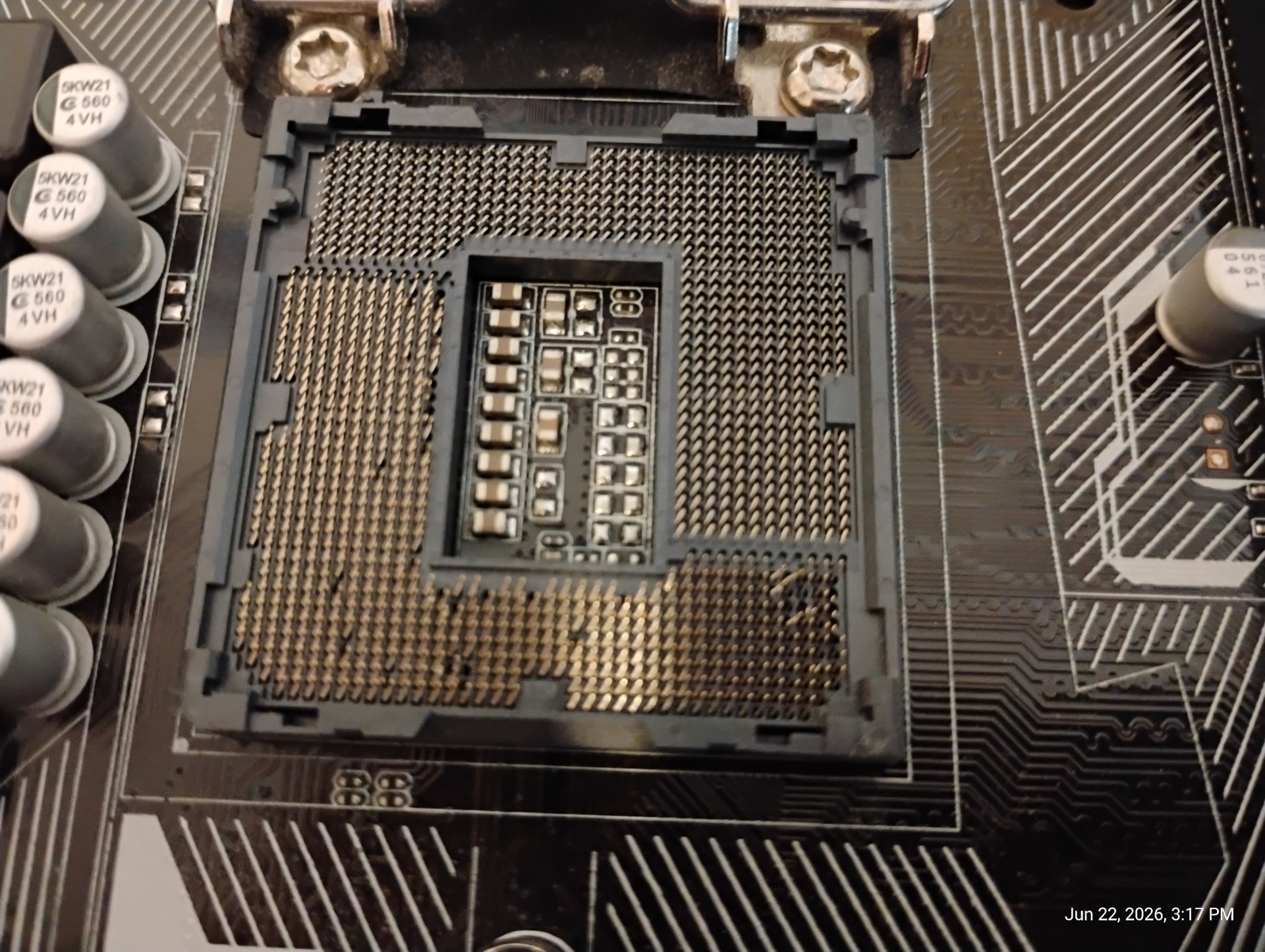 The CPU socket damage on the first motherboard
